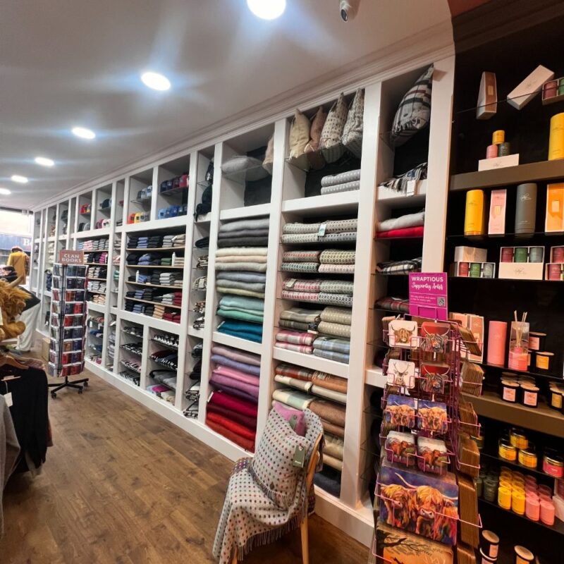 white shelfs displaying towels